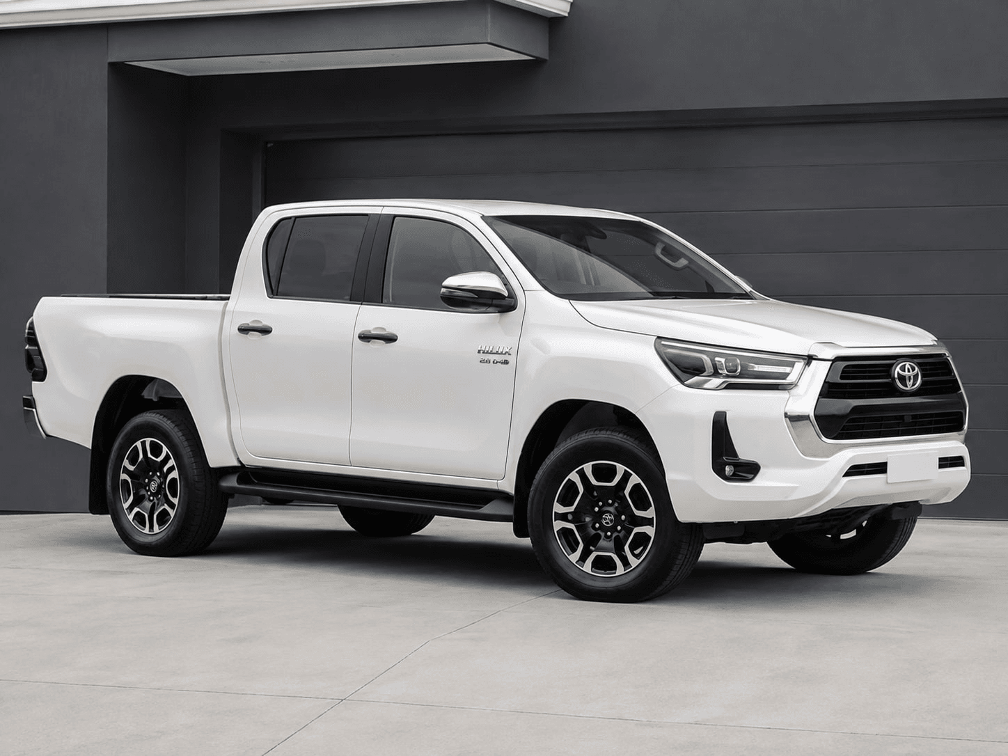 White Toyota Hilux double cab before the Nordak visualisation, with an open load bin and original wheels
