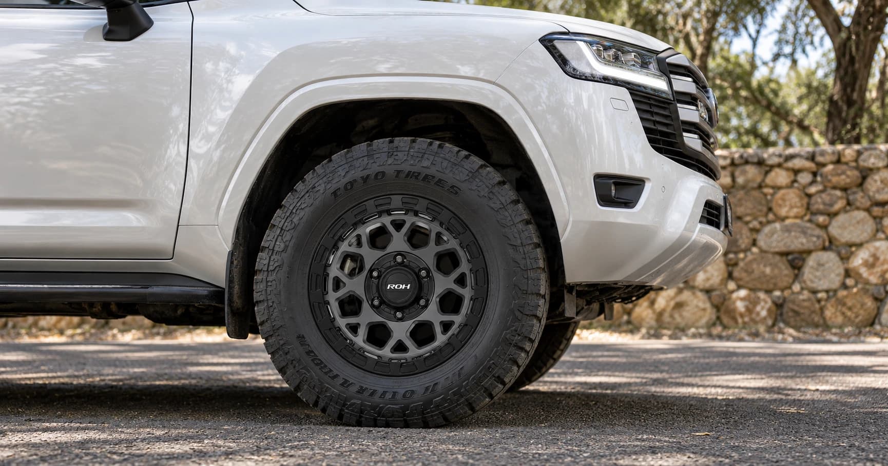 Front-wheel detail of a 2023 Toyota LandCruiser 300 GXL 4x4 with ROH Atlas wheels in Graphite Centre Black Lip