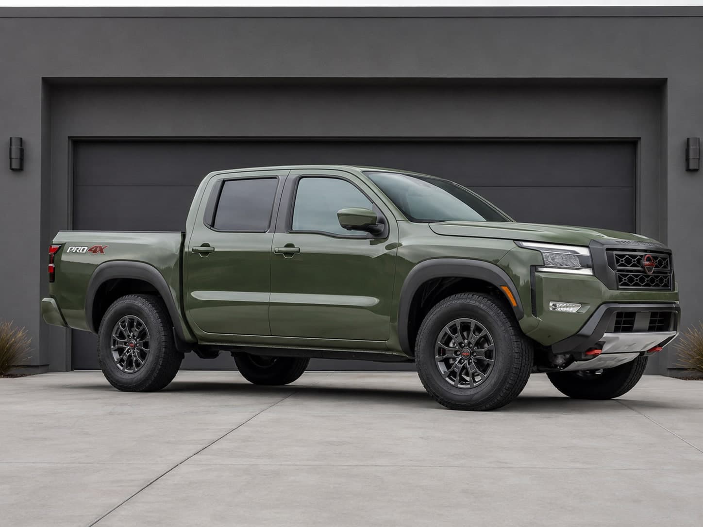 Original green Nissan Frontier before the selected upgrades