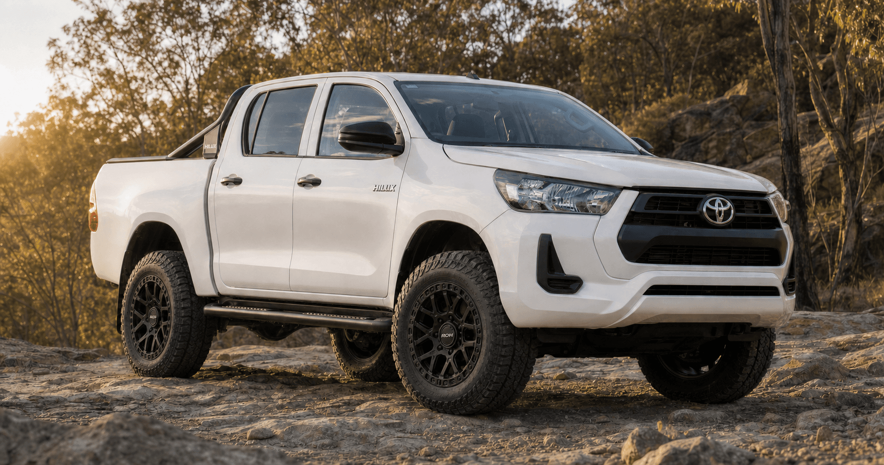 White Toyota HiLux N80 fitted with matte-black ROH Crawler wheels