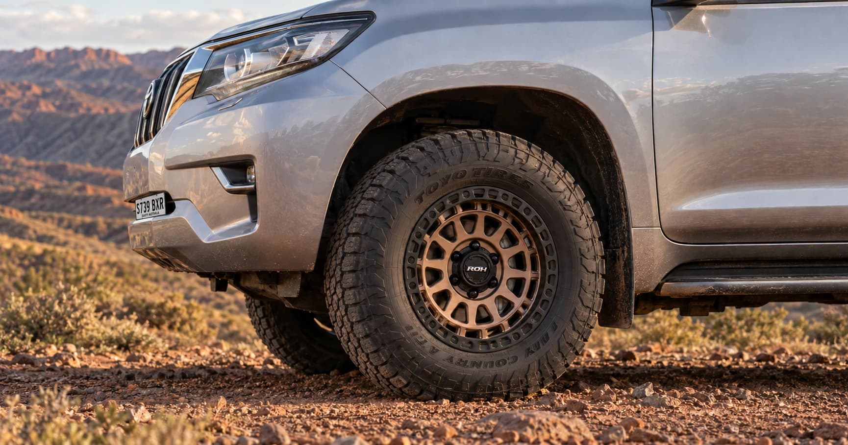 Front-wheel detail of a 2021 Toyota Prado GXL 4x4 with ROH Assault wheels in Bronze Centre Black Lip