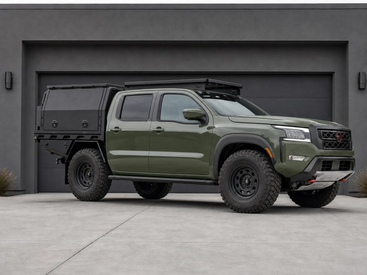 Nissan Frontier visual concept with a MITS Alloy canopy, Front Runner rack, side steps, black steel wheels and mud-terrain tyres